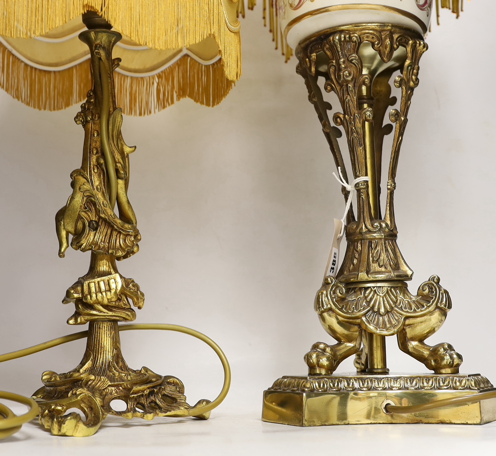 A Victorian-style brass and ceramic table lamp with beaded shade, and one other with cherub figure, tallest 62cm